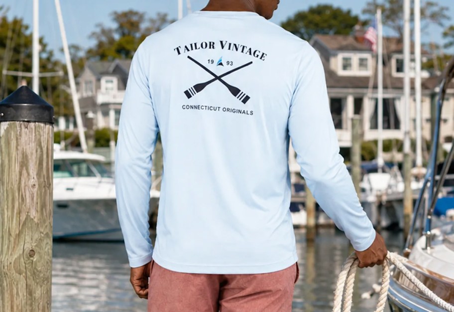 man wearing a light blue sun shirt