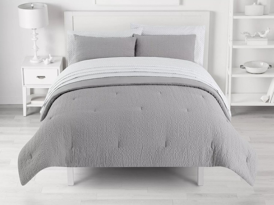 gray seersucker comforter set on a bed