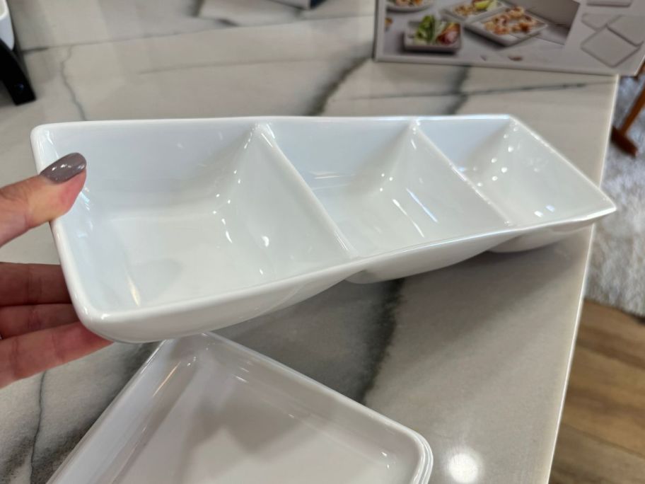 lina holding The Cellar James 3-Section Dip Bowl in kitchen