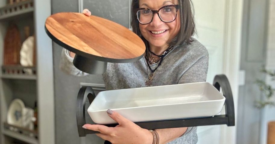 lina holding The Cellar Wood Cake Stand and Multi-Function Server