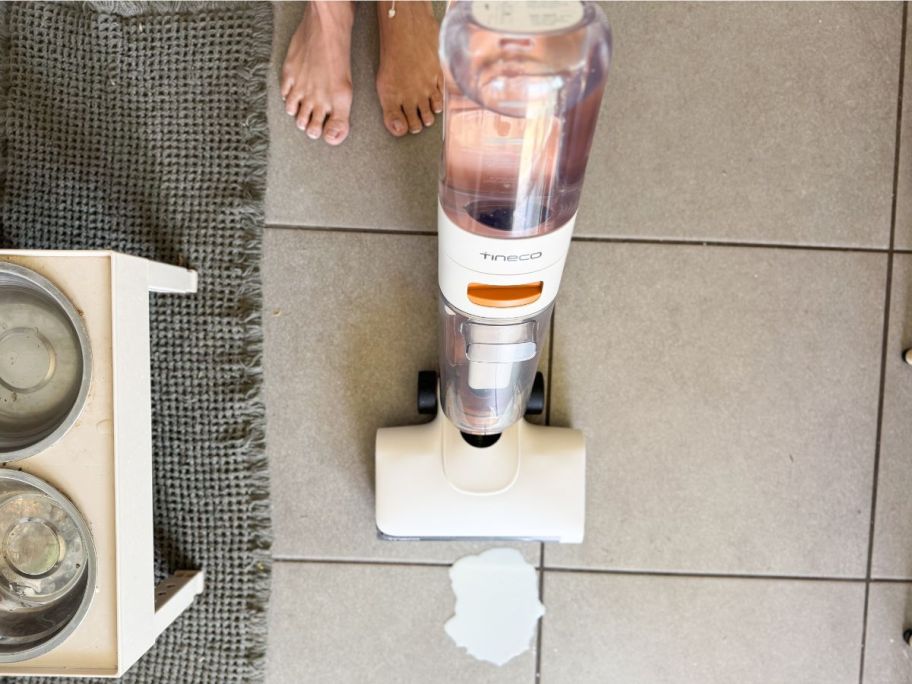 person using Tineco GO H2O Max Complete Cordless Floor Washer Vacuum