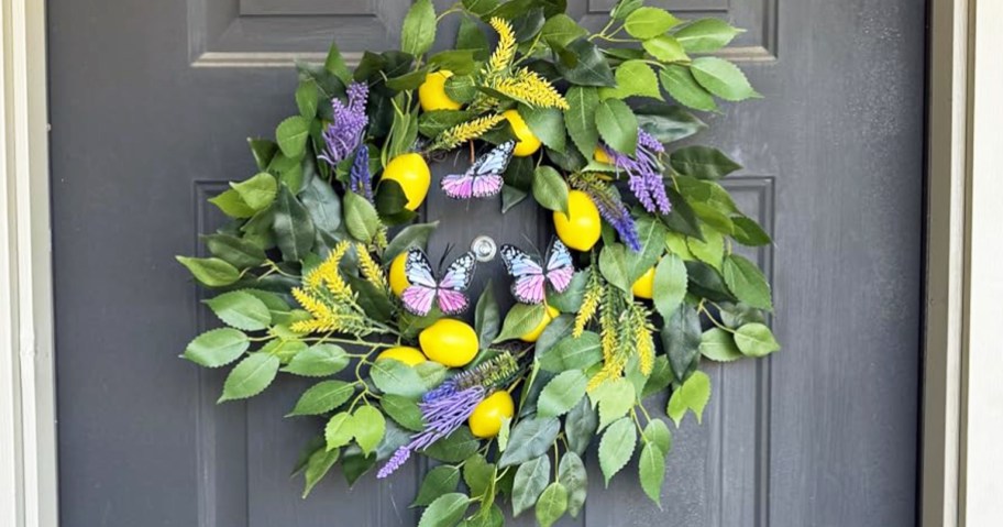 green wreath on door with lemons and butterflies