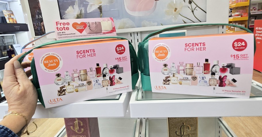 hand touching fragrance sampler kits on store shelf