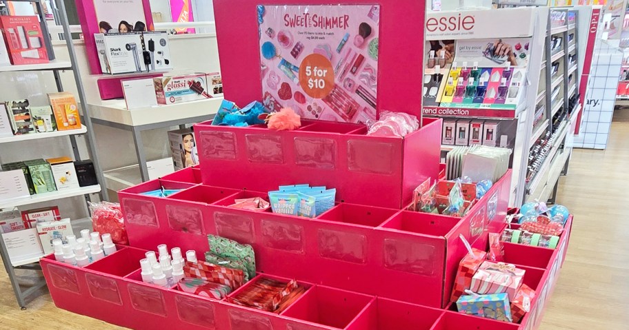 pink display full of mini beauty products and accessories in store