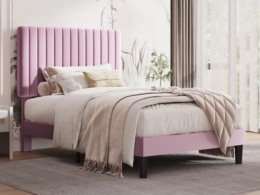 pink Willa Arlo Interiors Dunphy Upholstered Platform Bed w/ Adjustable Headboard in bedroom