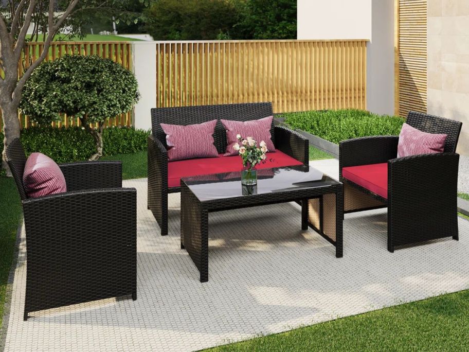 Winston Porter 4-Piece Outdoor Seating Group w/ Cushions on patio