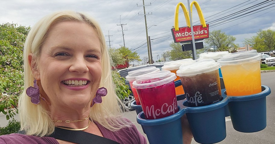 Woman holding tray of new Mcdonald's drinks