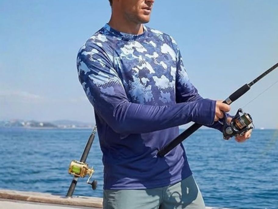 man wearing XiaoMoSha Men's Sun Protection Long Sleeve Shirts UPF 50+ Rash Guard while fishing
