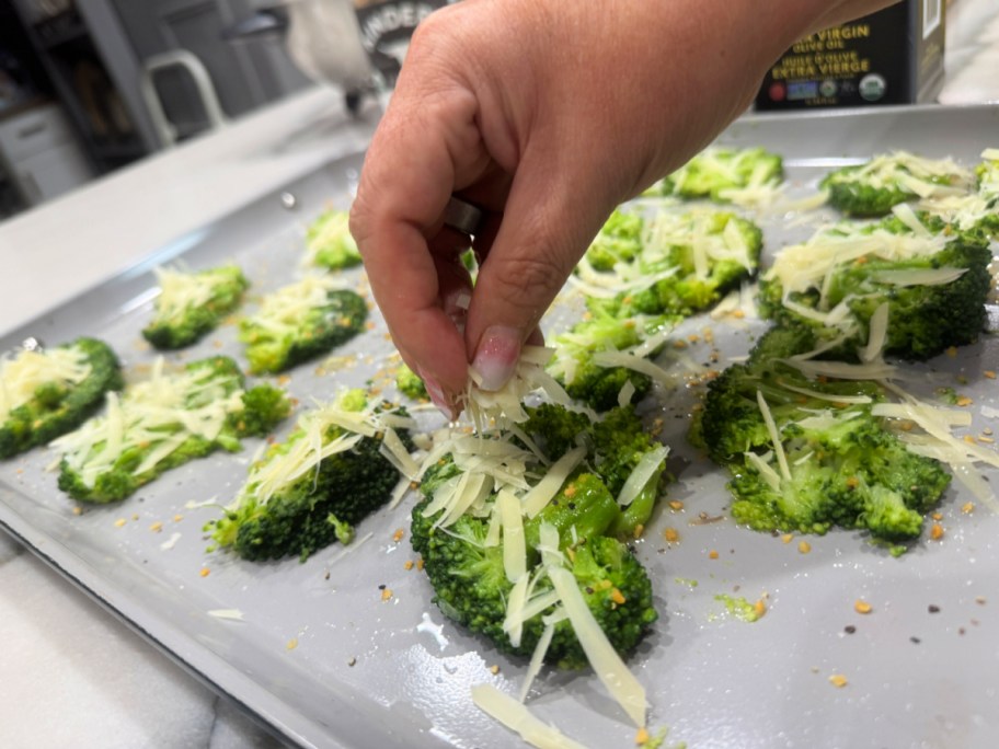 adding cheese to broccoli 