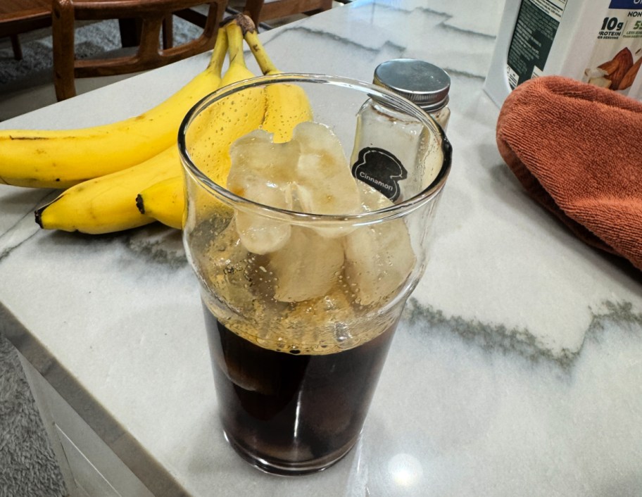 adding espresso to cup of ice