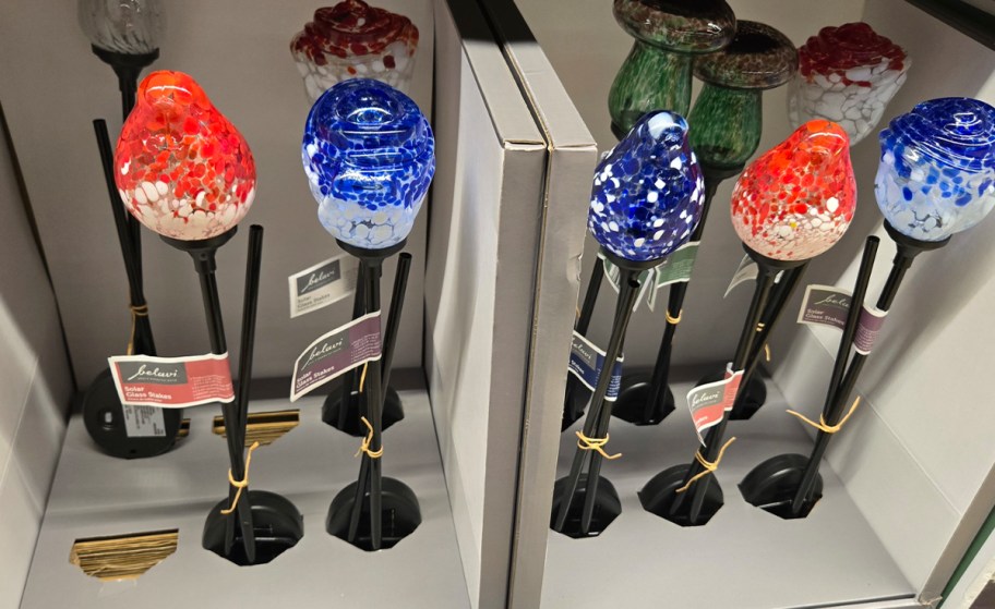 red and blue glass stakes 