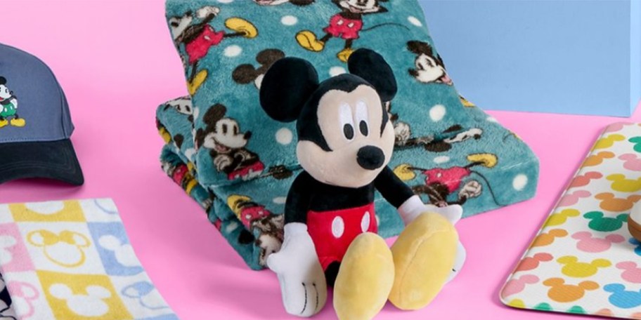 disney plush with blanket, hat, and pillow