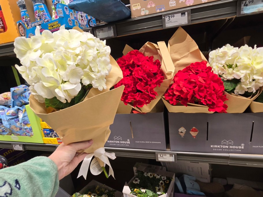 hand holding white flowers 