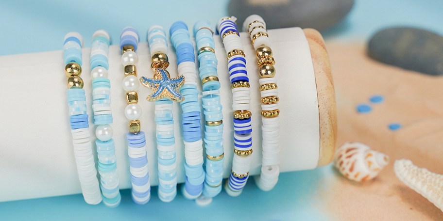 blue and white beaded braclets on stand 