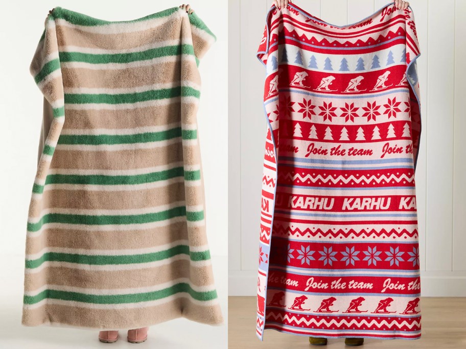 people holding tan and red blankets 