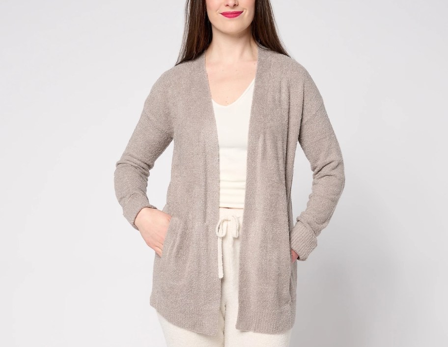 a woman in a barefoot dreams cardigan