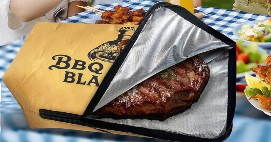 grilled meat inside a thermal meat bag on a picnic table