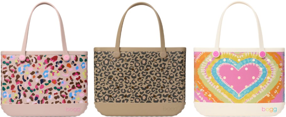 Three tote bags with different designs: colorful abstract print, leopard pattern, and a vibrant heart design. Each bag has sturdy handles.