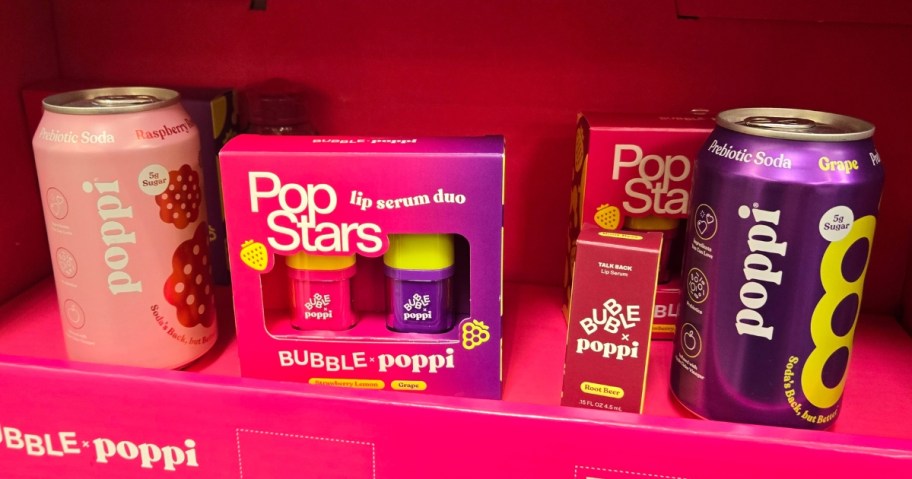 cans of Poppi soda with Bubble x Poppi Lip Serums on display at Walmart