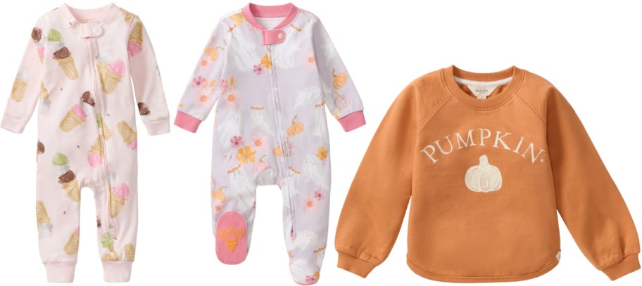 Burt's Bees Baby clothing items: a pink ice cream cone-print zip-up sleeper, a light purple ghost and pumpkin-print footed sleeper, and an orange crewneck sweatshirt with a white pumpkin graphic and "PUMPKIN" text.