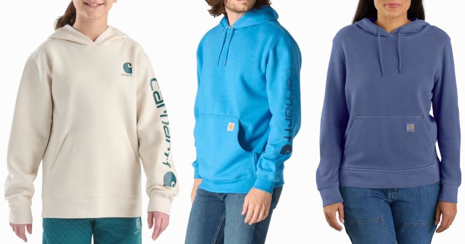 three people wearing carhartt hoodies