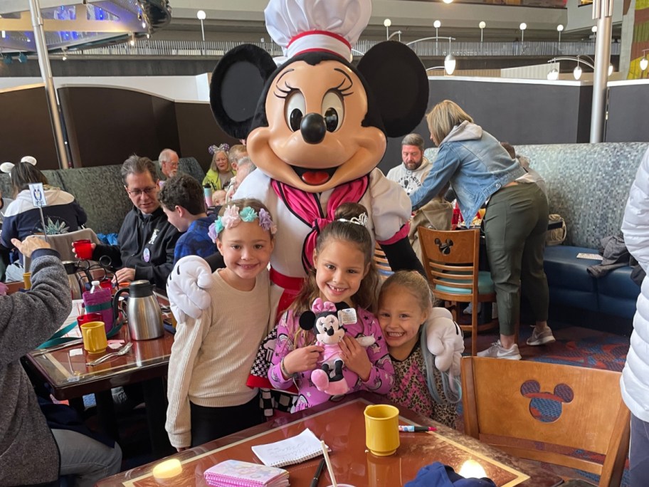 children with minnie mouse wearing a chef costume at a character breakfast