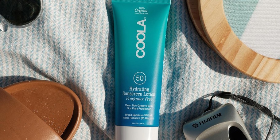 coola sunscreen on blanket