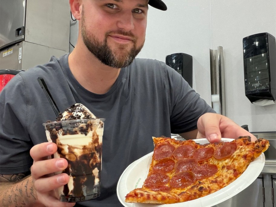 man in gray tee holding sundae and pizza slice