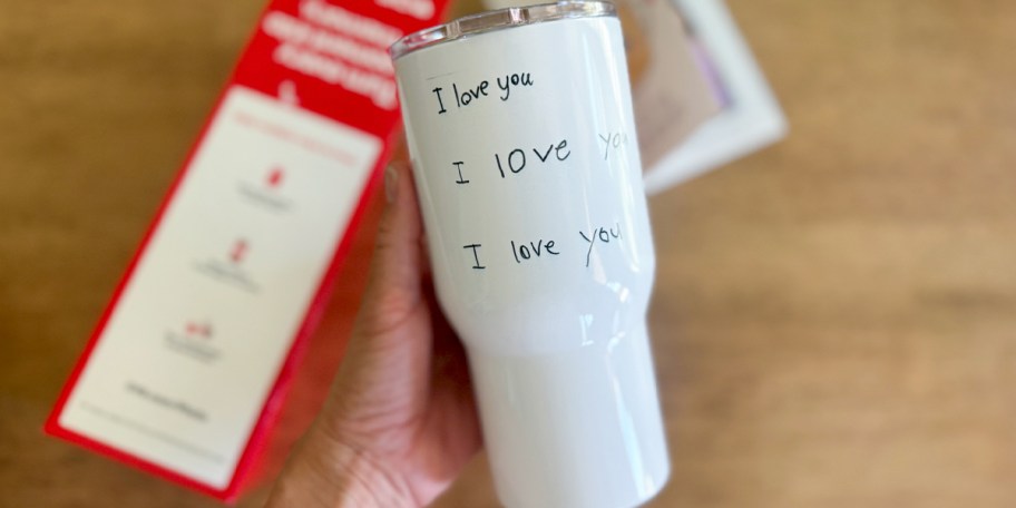 hand holding white i love you tumbler