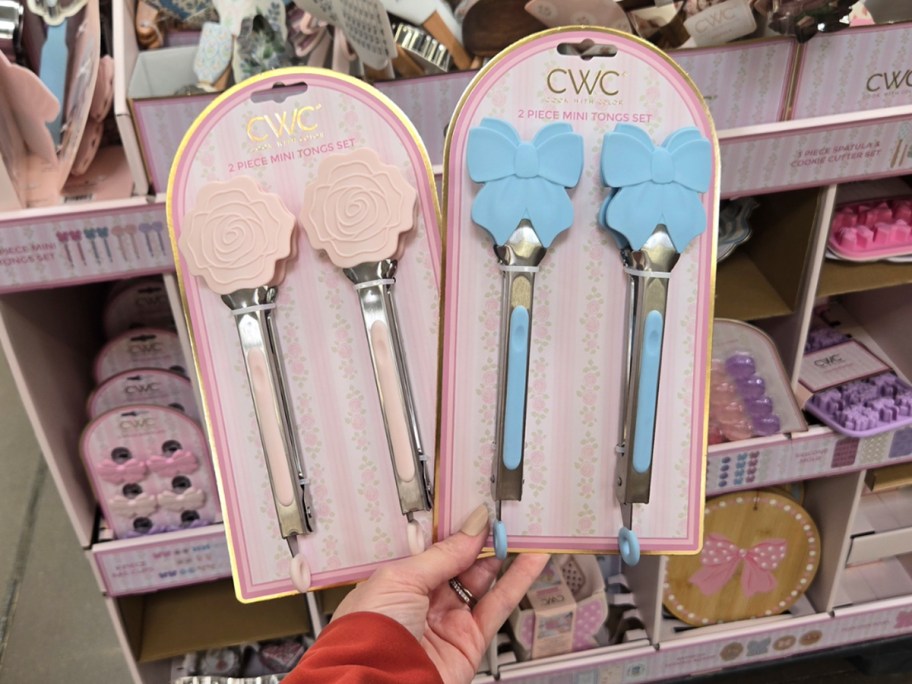 hand holding rose and blow bow tongs 