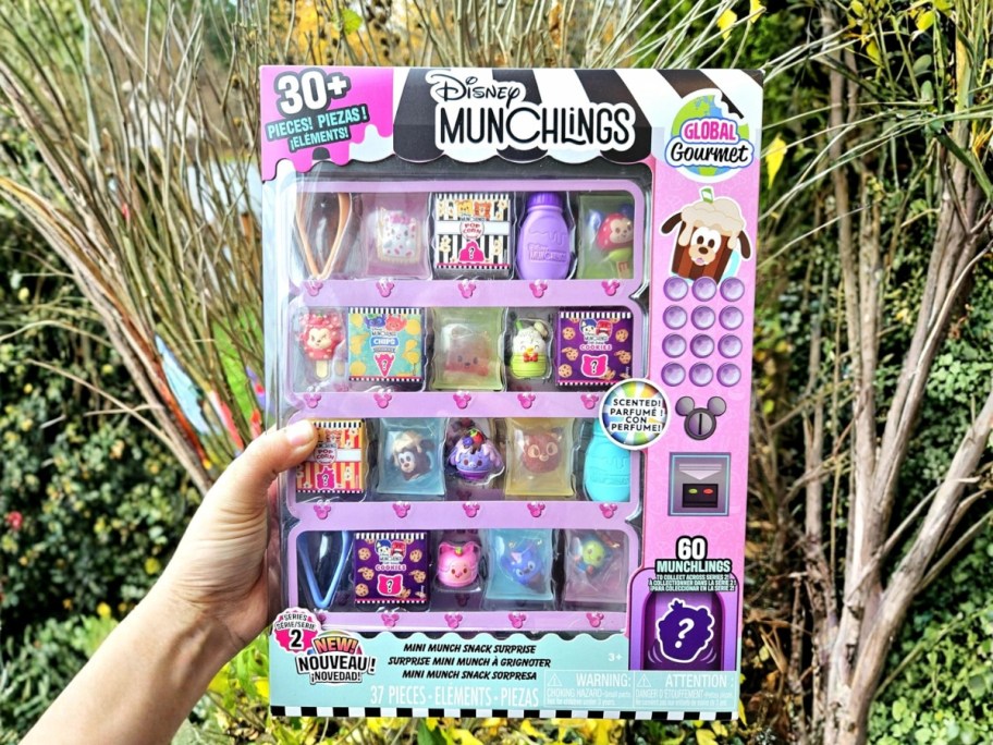 hand holding a Disney Munchlings playset