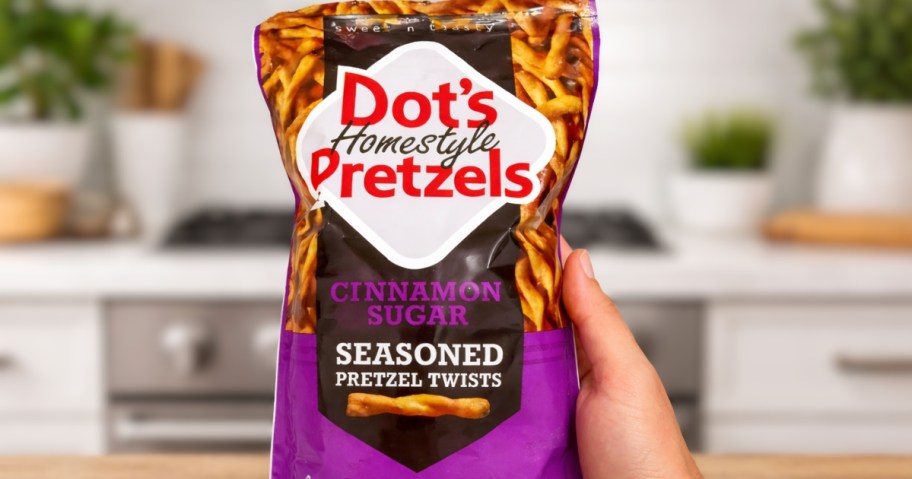 hand holding a bag of Dot's Pretzels Cinnamon Sugar Twists