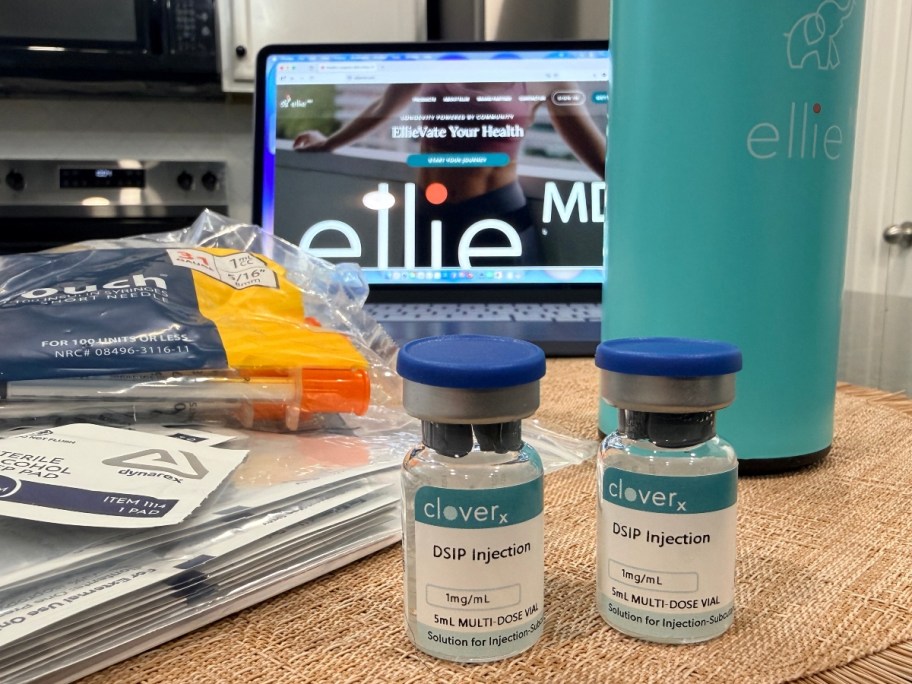 peptide vials in front of laptop