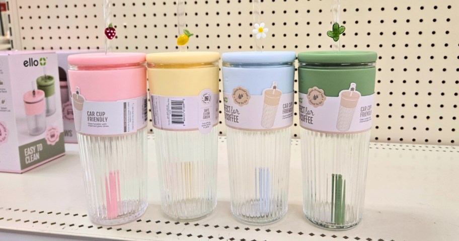 four glass straw tumblers on a store shelf