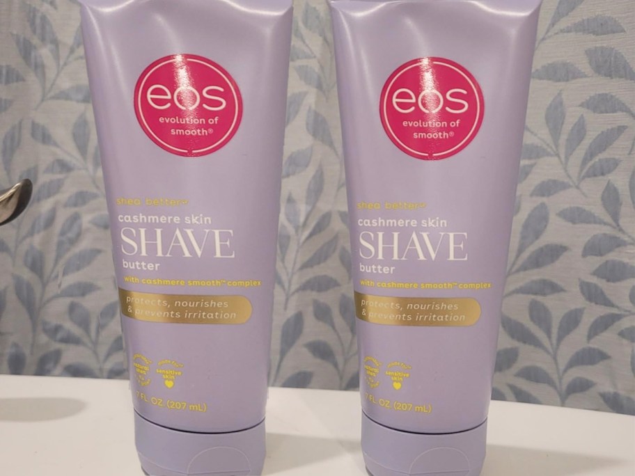 two purple tubes of eos Shave Butter on a counter