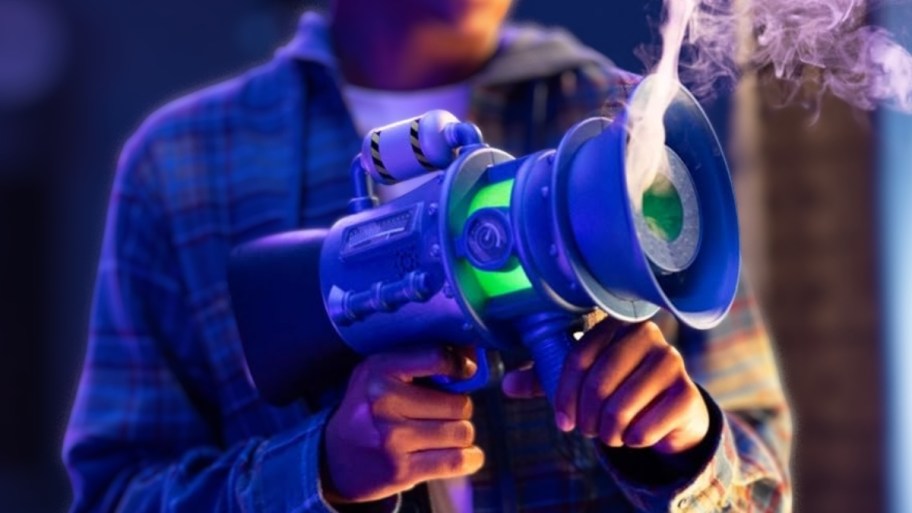 a kid holding a blaster pro