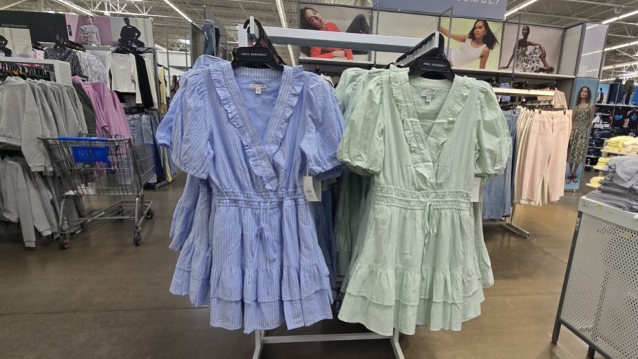 blue and green womens tiered mini dresses on a rack in a store