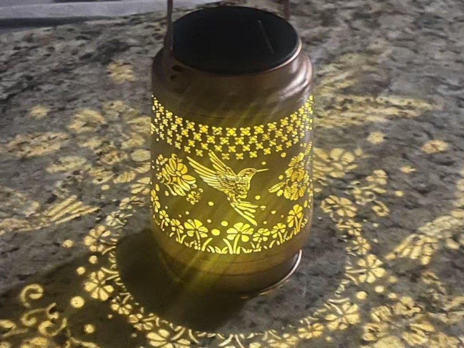 solar lantern with hummingbird pattern