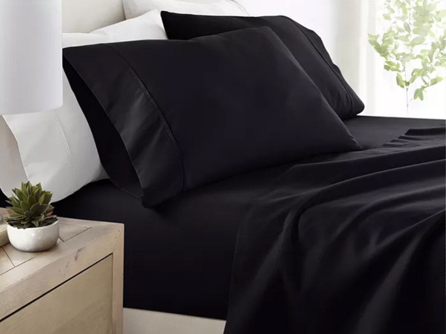 black sheet set on bed