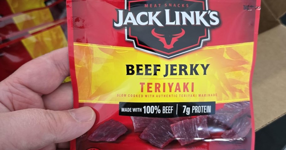 hand holding jack links beef jerky bag 