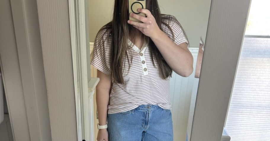 woman taking selfie in striped shirt