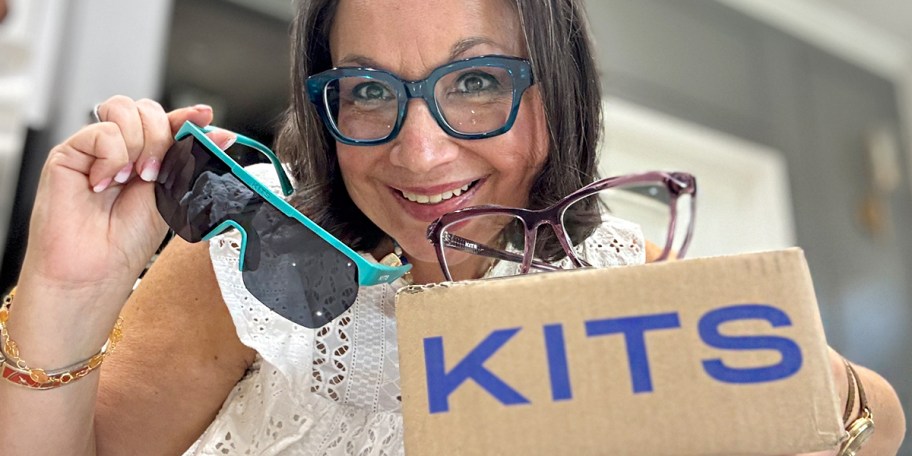 woman holding kits glasses and box