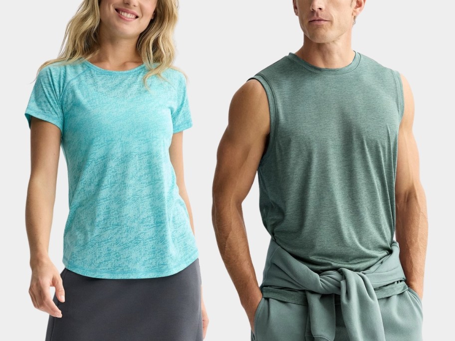 a woman in a tee and a man in a musle tee