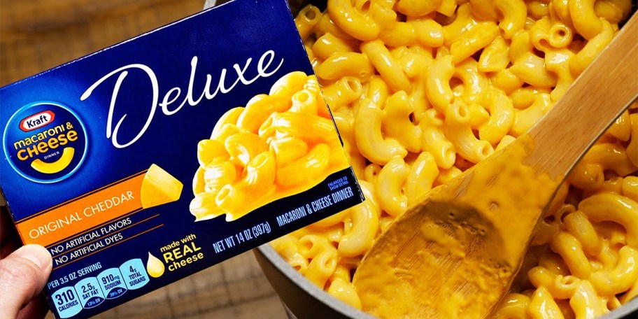 hand holding box of kraft mac and cheese
