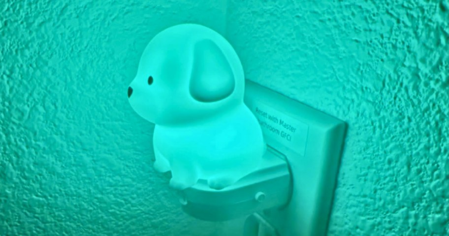 a puppy dog kids nightlight with a teal green color light