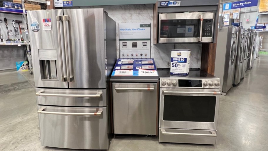 fridge, range, microwave and dishwasher in a grouping in a store