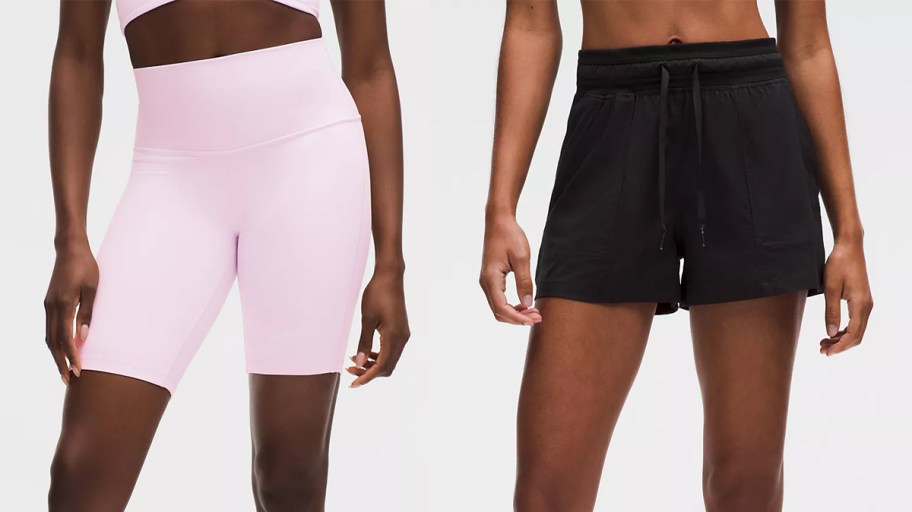 women in pink and black shorts