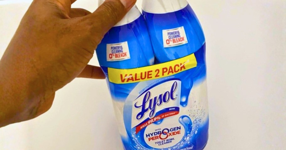 hand holding a 2 pack of Lysol Toilet Cleaning Gel Bottles