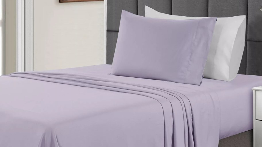 Macy's twin sheet set in lilac on a bed