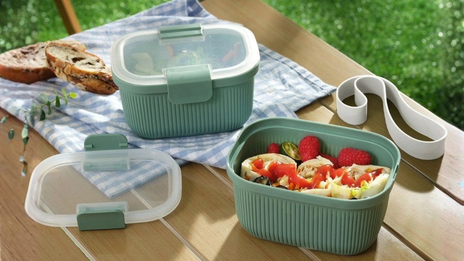 a set of green bento boxes 